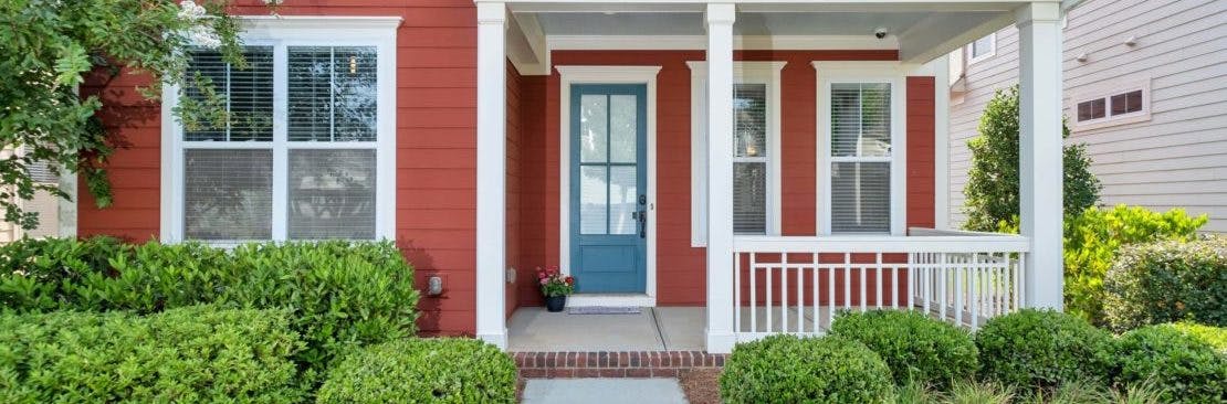 red home with blue door